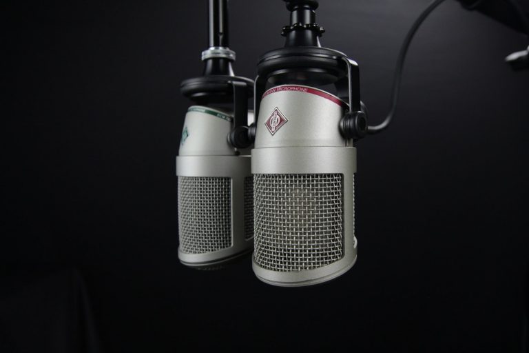 An image of two hanging microphones, used to represent voice search