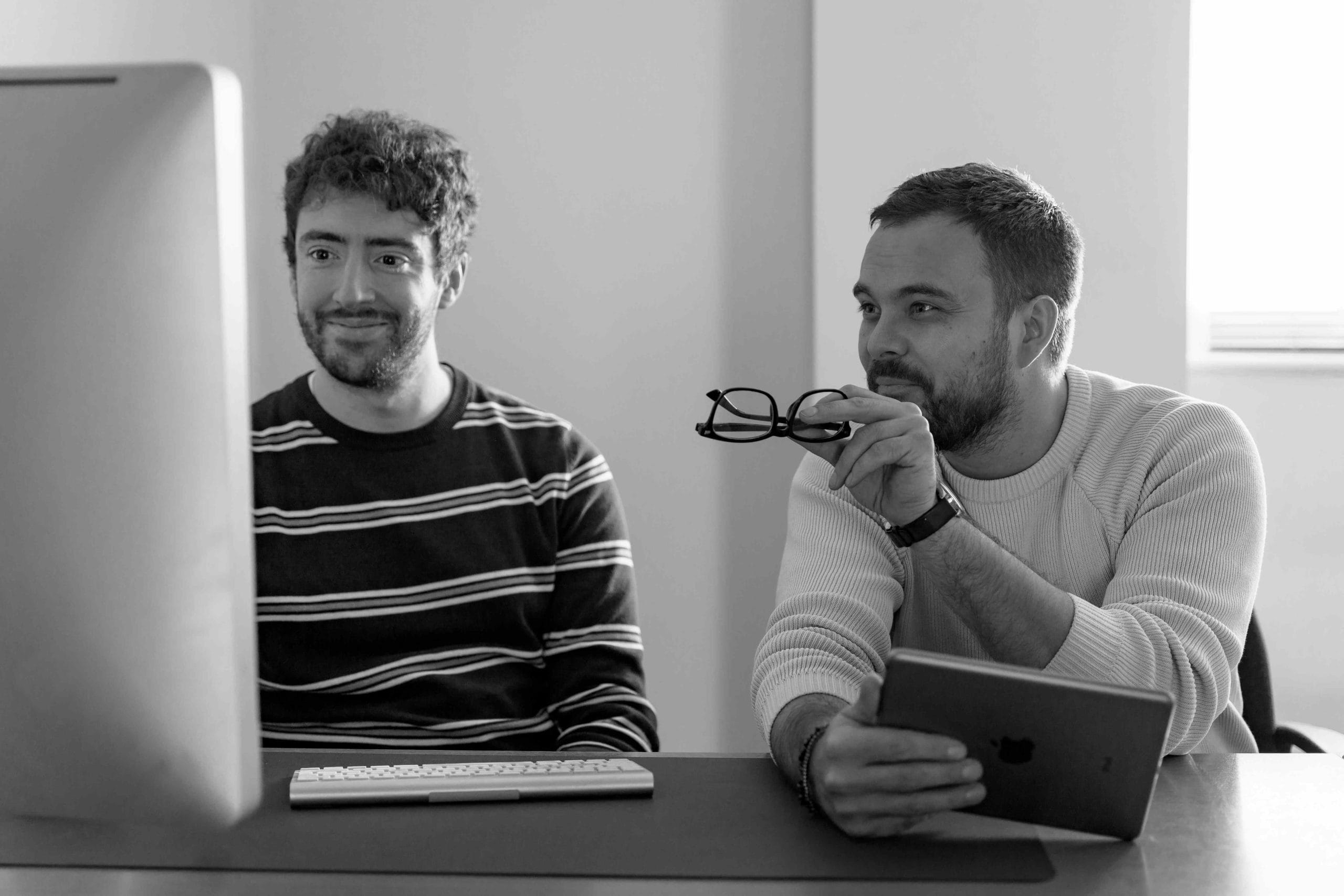 Ash and Tom looking over an SEO report
