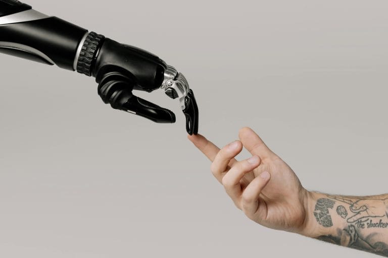 AI hand touching a human hand